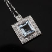 A white gold, aquamarine and diamond cluster pendant, of square form, on an 18ct white gold fine