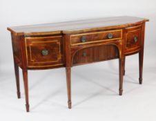 A George III mahogany breakfront sideboard, with satinwood and ebony line inlay, fitted two bow end