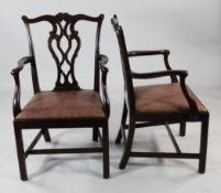 A pair of Chippendale style mahogany open armchairs, with pierced interlaced splat backs and drop
