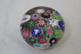 A Clichy millefleur paperweight, c.1860 with a design of spaced coloured cabbages and flower heads