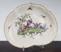 A Worcester polychrome kidney shaped dish, c.1770, the gilt dentil rim containing a painted