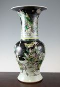 A Chinese famille noire yen-yen vase, Kangxi mark, early 20th century, painted with warriors and