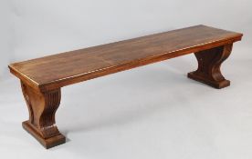 A 19th century Anglo Indian teak window seat, the rectangular top on reeded and part fluted trestle