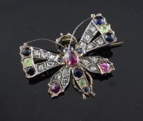 An early 20th century gold and silver, multi gem set butterfly brooch, including diamonds,