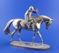 A 1990`s silver model of a horse and jockey after Geenty`s, ""At the start"", on textured oval