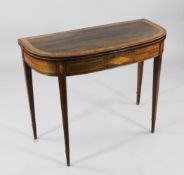 A George III rosewood and satinwood crossbanded D shaped folding card table, with square sectioned