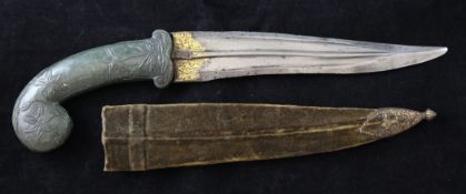 An Indian Mughal dagger, with floral carved spinach green jade handle, gold koftgari inlaid steel