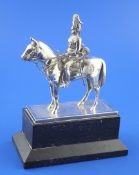 A 1990`s silver model of a Life Guard on horseback, on rectangular textured silver base, mounted on