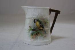 A Royal Worcester Great Tit painted jug, by D. Jones, c.1952, modelled as a coopered barrel, green