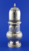 A 19th century Dutch 833 standard silver lighthouse sugar caster, with fluted lid and body and