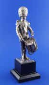 A 1980`s silver model of a Welsh Guards drummer, on an ebonised plinth base, Carrington & Co,