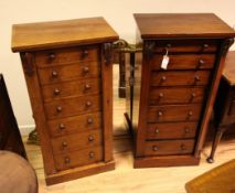 A near pair of Victorian mahogany Wellington chests, fitted seven graduated drawers within hinged