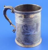A Victorian silver mug by Charles Thomas Fox and George Fox, of tapering form, with two reeded