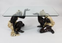 A 20th century rectangular blackamoor table, with plate glass top supported by a pair of crouching