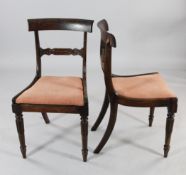 A set of six early Victorian rosewood dining chairs, with single carved spar backs, upholstered pad