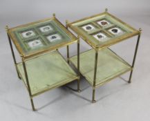 A pair of lacquered brass square two tier occasional tables, the top inset with porcelain panels,