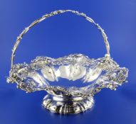 An ornate William IV silver fruit basket by The Barnards, of shaped circular form, with pierced