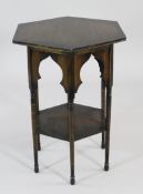 A Liberty Moorish hexagonal two tier table, with pointed arch panels and turned tapering supports,