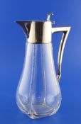 A stylish early 20th century German 800 standard silver mounted glass claret jug, of tapering form,