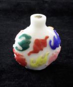 A Chinese five colour overlaid glass snuff bottle, 19th century, carved in relief with twelve bats