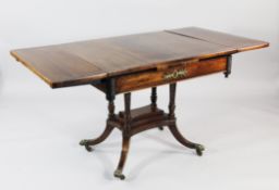 A Regency rosewood and brass inlaid table, now converted to a draw leaf table, on twisted supports,