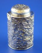 An early 20th century Japanese silver tea caddy, of shaped cylindrical double skinned form,