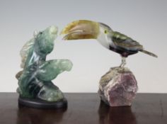 A quartz and agate carved model of a toucan, 7.5in., together with another carved quartz group of