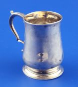 A small George III silver baluster mug, with acanthus leaf capped scroll handle, Walter Brind,