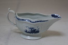 A Worcester `Little Fisherman` pattern sauceboat, c.1760 painted in underglaze blue with fisherman