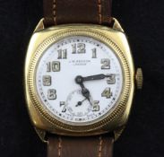 A gentleman`s 1920`s/1930`s 18ct gold J.W. Benson manual wind wrist watch, with milled bezel and