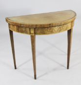 A George III mahogany and satinwood crossbanded demi lune folding card table, with marquetry and