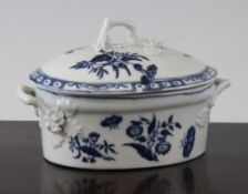 A Worcester `Three Flowers` pattern ovular buttertub and cover, c.1770, with twig shaped handles,