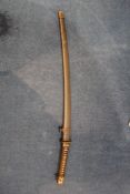 A World War II Japanese naval katana, with ray skin handle and gilt bronze tsuba, the blade with