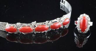 A late 20th century 18ct white gold and cabochon coral set bracelet and matching dress ring, ring