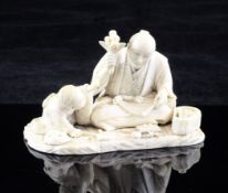 A Japanese ivory okimono of a father and son, signed Seiwa, Meiji period, both kneeling or seated