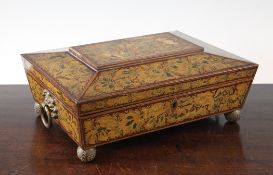 A Regency red lacquered sarcophagus shaped work box, with all over gilt floral decoration, with