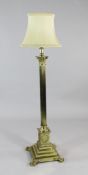 A 20th century corinthian column brass standard lamp, on stepped square base and ball and claw