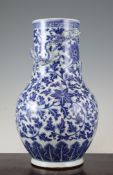 A Chinese blue and white vase, 19th / 20th century, painted with lotus flowers and scrolling leaves
