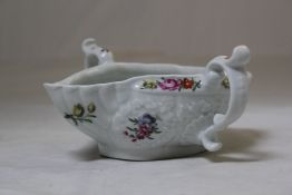 A Worcester polychrome two handled sauceboat, c.1770, the exterior decorated with painted floral