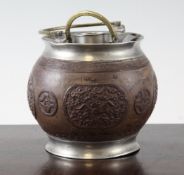 A Chinese coconut and pewter mounted teapot, 19th century, the lacquered coconut carved in relief