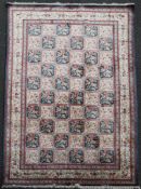 A 1960`s North Persian Qum silk ""garden"" carpet, with field of alternating squares decorated with