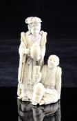 A Japanese ivory group of Benten and a seated man, Meiji period, unsigned, the standing figure of