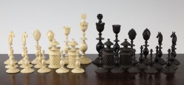 An Indian Vizagapatam carved ivory and horn chess set, c.1820. with 4.5 inch king, complete with