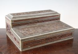 An Anglo Indian carved sandalwood and sadeli writing slope, with hinged top revealing lidded