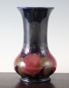 A Moorcroft Pomegranate vase, c.1928, of baluster form with trumpet shaped neck, inscribed W