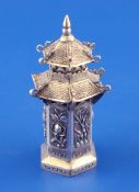 An early 20th century Chinese silver spice tower?, of pagoda form, decorated with floral panels,