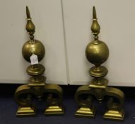 A large pair of late 19th / early 20th century bronze andirons, with ball and spike finials and