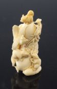 A Japanese ivory snuff bottle, early 20th century finely carved with three squirrels and a phoenix