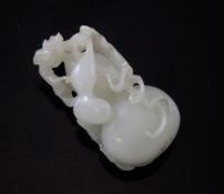 A Chinese celadon-white carving of a gourd, carved in open work with tendrils and leaves, 5.3cm.