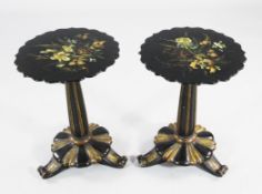 A pair of Victorian circular occasional tables, each with papier mache tops with polychrome floral